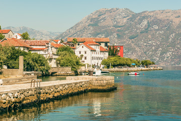 Fototapeta na wymiar View of the embankment in Prcanj in Kotor Bay, Montenegro.