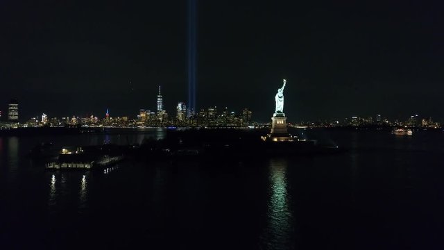 Aerial View of New York City Skyline & Statue of Liberty 9/11 Memorial at Night