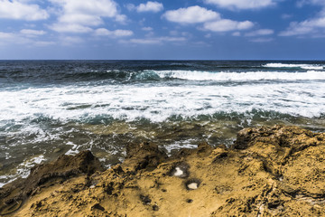 Foamy surf on a rocky coast