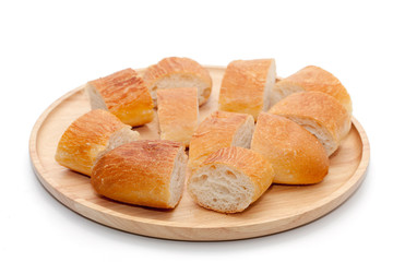 a slice of french bread on wooden plate