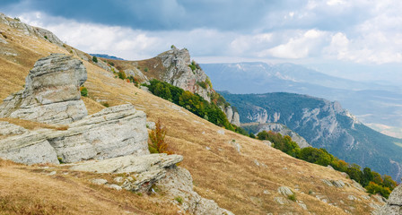 Mountain landscape with weathered rocks on a foreground