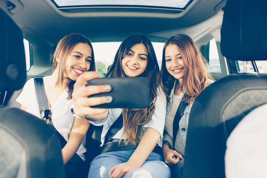 Girls Friends In The Car Making A Selfie