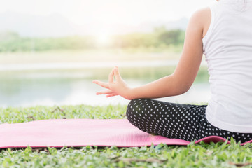 Close up hands. girl do yoga outdoor.