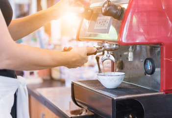 Hand woman making coffee cup machine