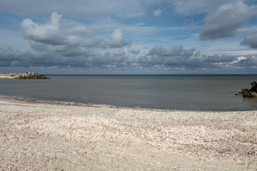 Seascape with breakwater irregularly arranged on seaside, at Gura Portitei, Romania