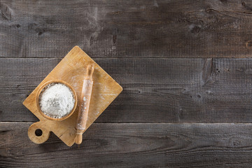 Cup of flour and cutting board