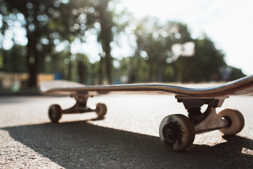 One skateboard on the road. Extreme sport challenge and skateboarder competition, close up picture...