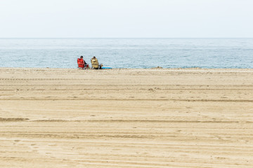 Friends relaxing oceanside