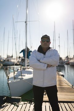 Yachtsman standing on the pier