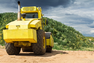 Fototapeta na wymiar Large yellow tractor