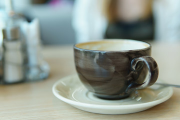 cup of coffee on table in coffee shop cafe