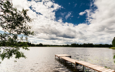 Wooden bridge on the river bank