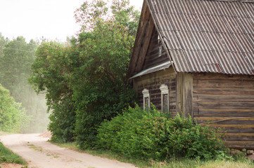 Fototapeta na wymiar Old wooden hut in village