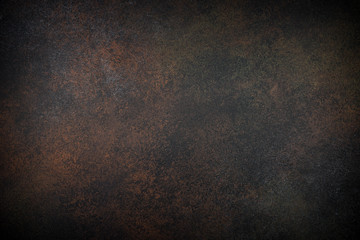 Rusty stone or metal background. Brown slate texture.