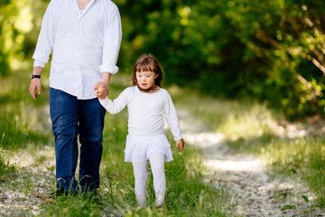 Fototapeta premium People with down sydrome walking in forest