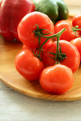 Tomatoes on wood plate