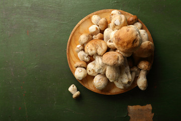 Forest mushrooms on wood plate
