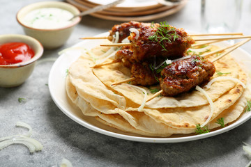 Barbecue beef kebabs and flat breads