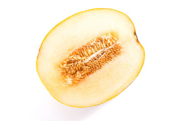 Half honeydew melon tropical fruit isolated on a white background.