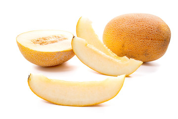 Whole, half and sliced honeydew melon tropical fruit isolated on a white background.