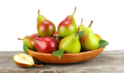 pear with leaf on old wooden table with white background