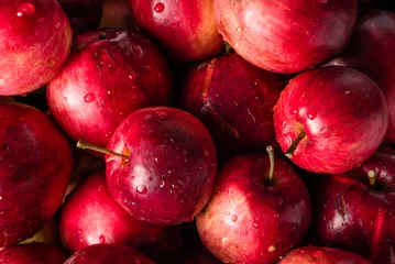 Fotobehang Red apples background, pile of fresh apple fruits, natural textu © alicja neumiler