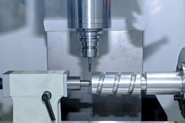 Metal billet is machined on milling machine