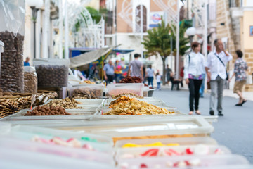 sale of snacks on a stall during a patron saint