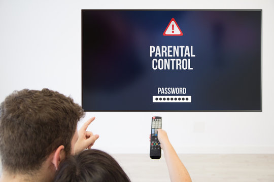 Couple Setting Up Parental Control On Tv