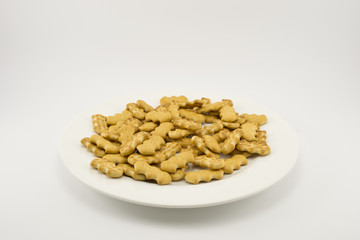 Cracker scattered on a white plate on an isolated background