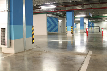 Empty parking garage underground interior in apartment or in supermarket