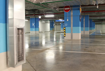 Empty parking garage underground interior in apartment or in supermarket