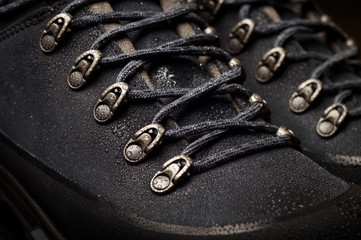 Tourist boots for mountain hikes with reinforced soles and membrane material.