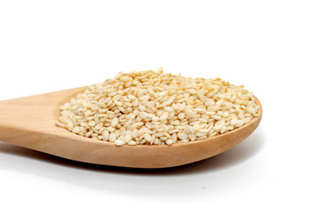 white Sesame on wood spoon on white background