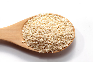 white Sesame on wood spoon on white background