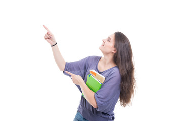 Happy university student holding books