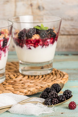 Spoons with blackberries
