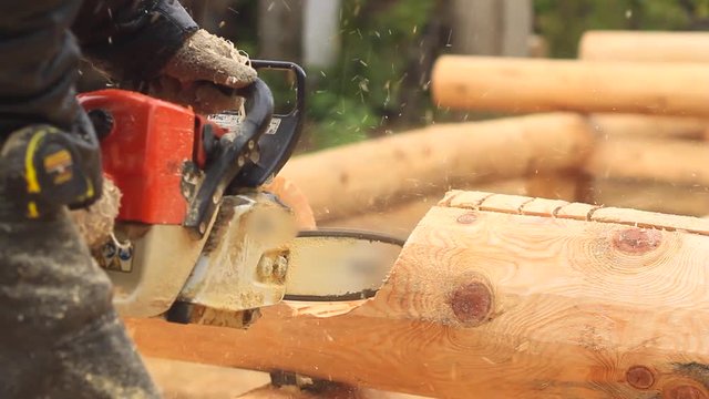 Saw sawing wood for home