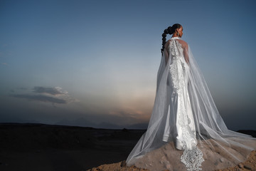 Fototapeta na wymiar Girl in wedding dress outdoor.