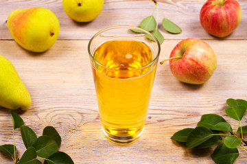 Glass of cider with apples and pears. Cider with fruits. Food and drink concept