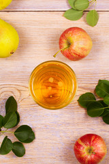 Glass of cider with apples and pears. Cider with fruits. Food and drink concept. View from above, top studio shot, overhead