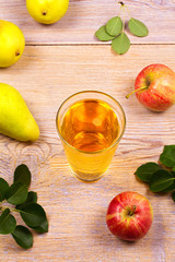 Glass of cider with apples and pears. Cider with fruits. Food and drink concept. View from above, top studio shot, overhead