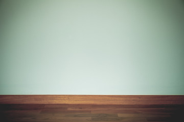 vintage green wall with wood floor