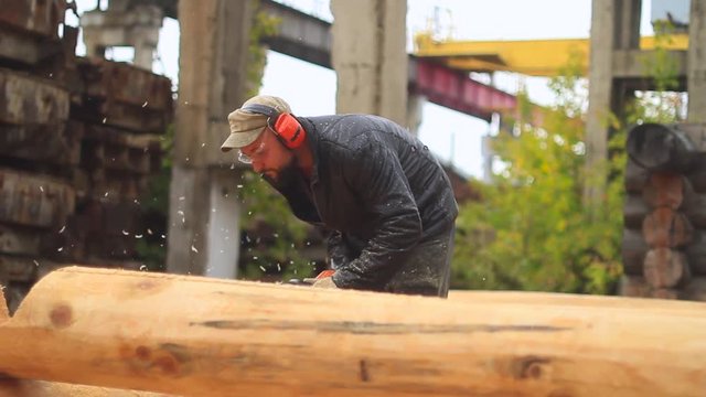 Saw sawing wood for home