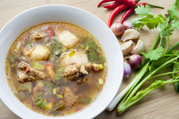 Hot and spicy soup pork on wooden plate