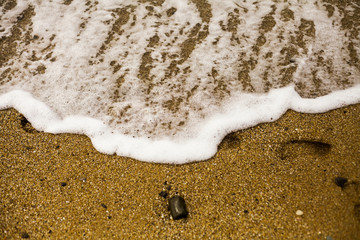 Kids footprints on the sand on Black Sea