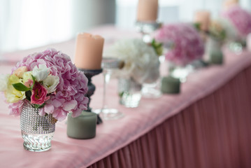 Wedding stylish decor elements in banquet hall closeup