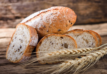bread and wheat on the wooden