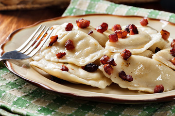 Dumplings with meat or cabbage and mushroom or cheese seasoned fried bacon