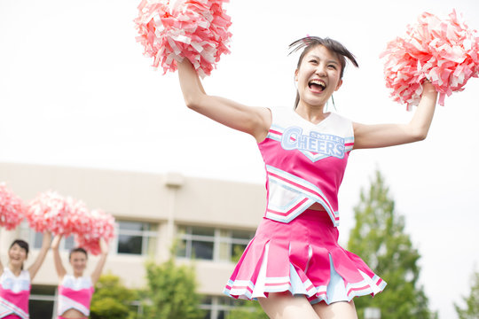 Three Cheerleaders Screaming and Cheering